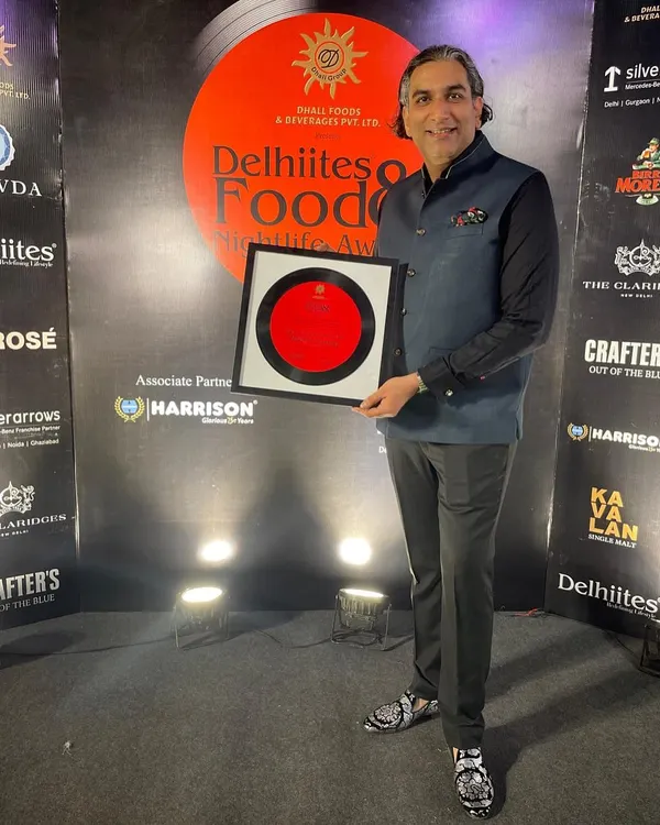 Holding the 'Luxury Caterer of the Year' award from the Delhiites Food & Nightlife Awards 2025. A proud moment for the entire Modern Catering team.