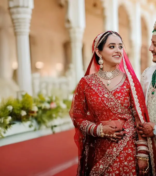 A candid moment between the bride and groom, sharing a glance after their wedding ceremony at a beautiful heritage location.