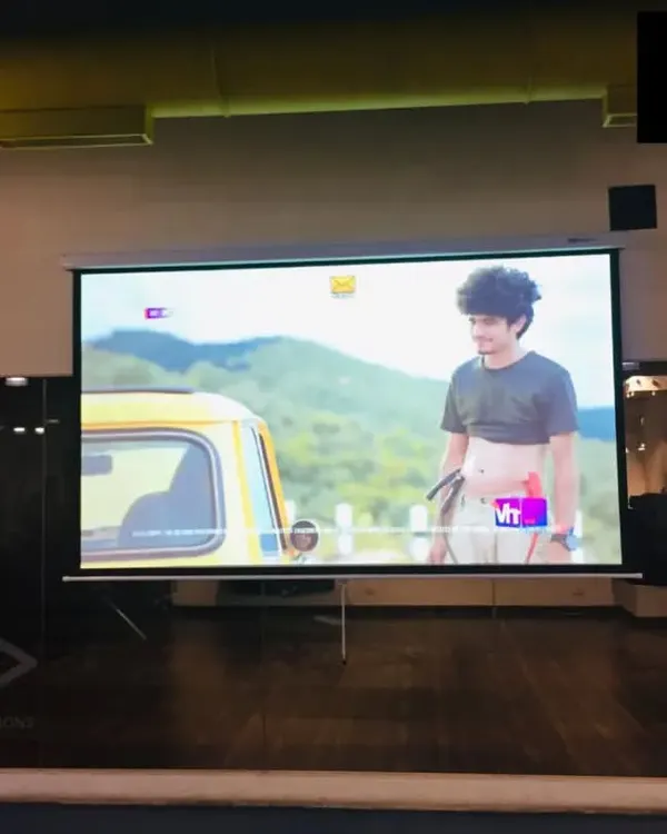 An Epson Full HD projector and a 120-inch motorized screen we installed in a Mumbai gym. This setup provides a big-screen experience for members, adding significant value to the facility.