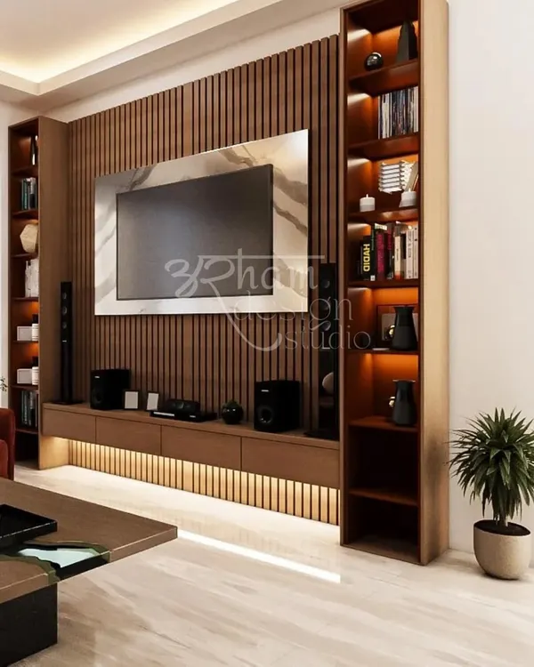 This living room is the heart of a Delhi vacation home we designed for a family from Kashmir. We used vertical wooden fluting and warm backlighting for the TV unit to create a modern yet cozy focal point, echoing the rich walnut wood tones of their home state.
