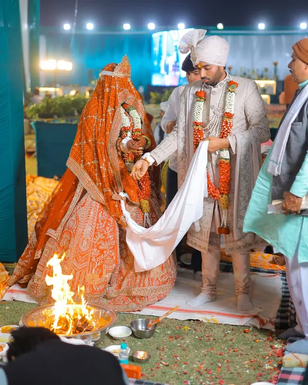 A key moment from a Hindu wedding ceremony, as the couple performs the pheras around the sacred fire. I capture these rituals from angles that show the tradition and emotion.