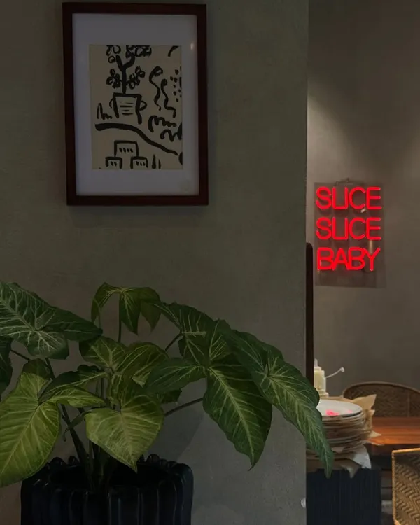 Weekends carry a different kind of stillness. My space, with its playful neon sign and lush plants, invites you to stay a little longer and taste without hurry.