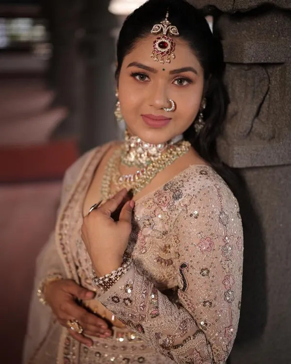 A close-up of this elegant light pink lehenga with silver embroidery. It's a perfect choice for a bridesmaid or for attending a wedding.