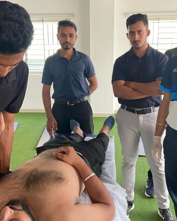 A demonstration of manual therapy techniques for the shoulder complex during a team training session. This hands-on approach allows us to feel for tissue restrictions and apply precise force to release them.