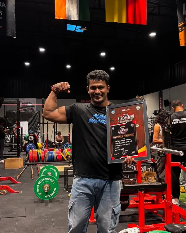 Holding the "Strongman of India" 2025 trophy. This is the culmination of countless hours of training and sacrifice.