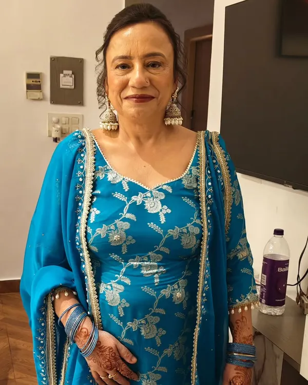 Makeup for mature skin is all about enhancing, not hiding. For this lovely client, I focused on creating a luminous base and adding a pop of color with her beautiful blue suit.