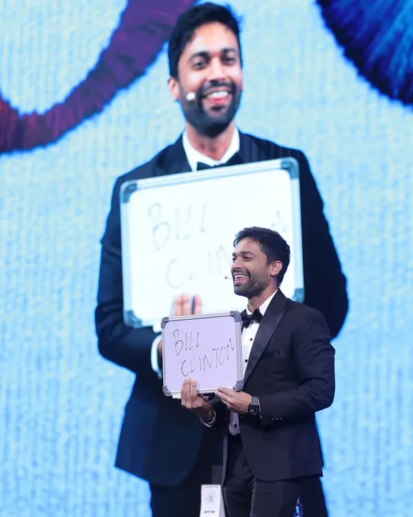 This is the moment of the big reveal. After a series of questions and interactions, I revealed the celebrity name an audience member was thinking of: Bill Clinton. The use of the big screen ensures everyone in the 500-person crowd shares in the astonishment.