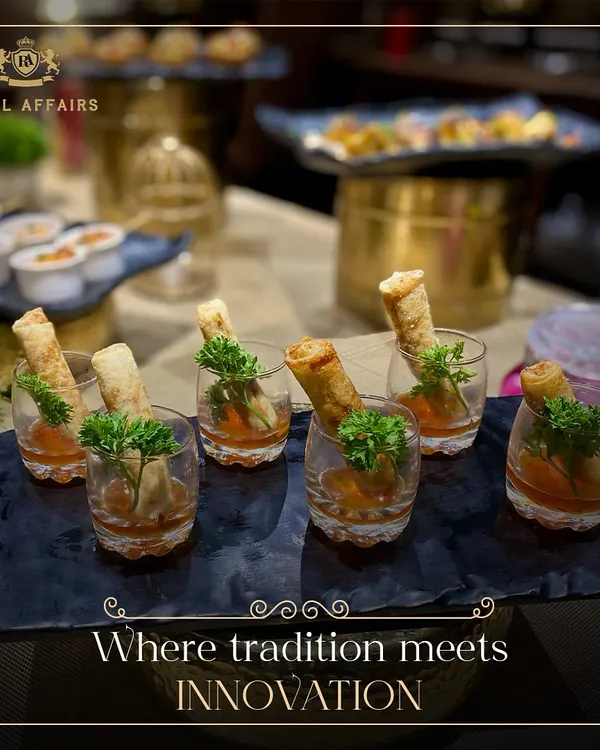 I combine tradition with innovation in my appetizer creations. These spring rolls are served in individual shot glasses with sweet chili sauce, a modern presentation that is both elegant and practical.