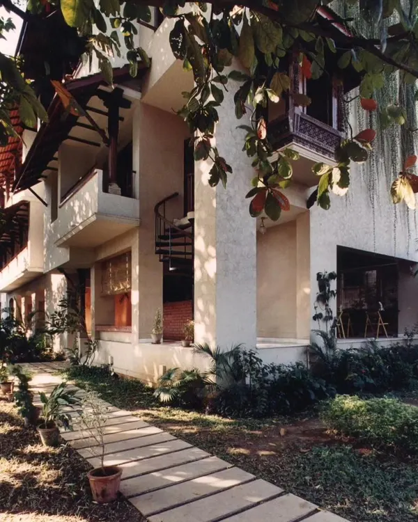 The Ayushakti Health Resort in Mumbai, a tranquil oasis designed on a narrow urban plot. The building's form uses setbacks and balconies to maximize light and air.
