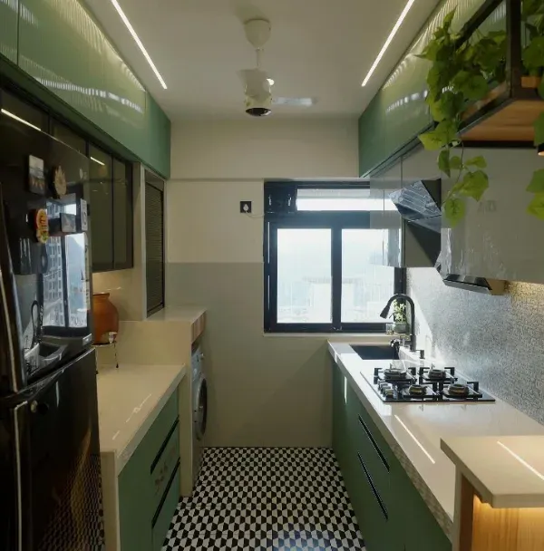A stunning open-plan kitchen featuring sage green cabinetry, a breakfast bar with a wooden finish, and a striking checkered floor. The overhead unit with integrated planters brings a touch of nature indoors.