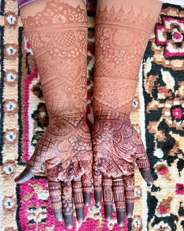 The beautiful, rich brown stain of a full bridal-style henna design after 48 hours.