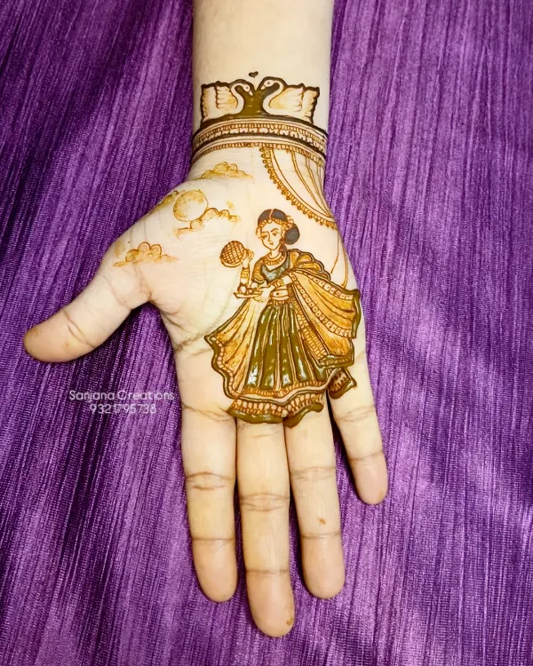 The beginning of a special Karwachauth piece. Here you can see the fresh henna paste outlining the figure of the woman. The smooth silicone surface allows for such clean application.