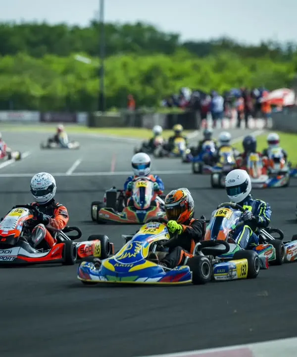 The moment before the lights go out. A full grid of senior max drivers at the National Rotax Max Karting Championship, all fighting for position into the first corner.