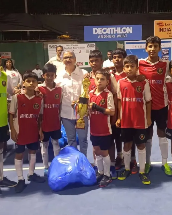 Our U13 team after a tournament, showcasing their medals and trophy.