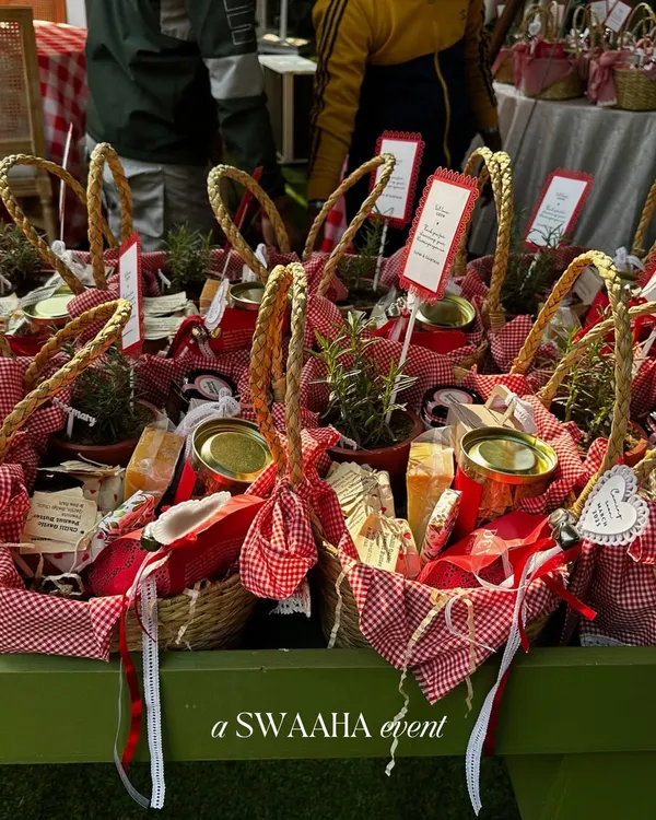 Adorable picnic baskets filled with goodies for a sunflower-themed baby shower. These personalized favors were part of a rustic, storybook-like celebration.
