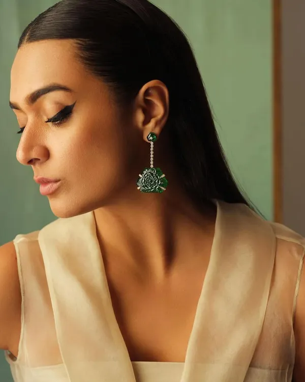 A close-up on these magnificent carved emerald and diamond earrings. This showcases my focus on finding unique, art-deco inspired pieces that become conversation starters.