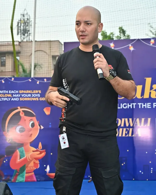 Here I am leading a presentation at an educational institution, explaining the principles of weapon awareness and defense. We take our mission to empower communities seriously.