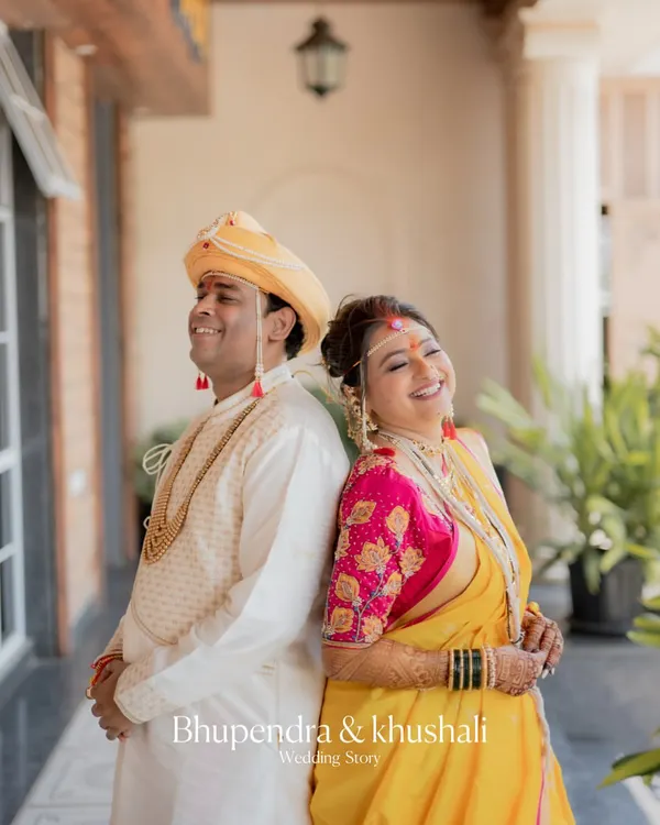 A joyful, candid moment between a Maharashtrian bride and groom. I love capturing these unscripted laughs that show the couple's true personality.