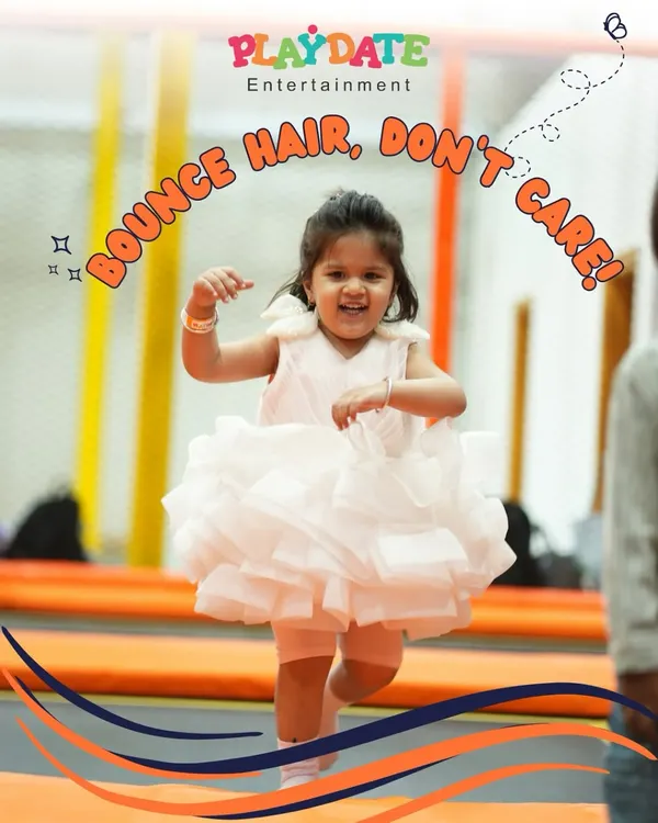 "Bounce hair, don't care" is the motto in our trampoline park. This little girl in her party dress is having the time of her life, and her smile says it all.