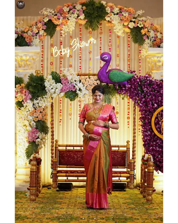 Capturing the mother-to-be during her baby shower ceremony. I document all the details, from the elaborate floral decorations and traditional swing to the happy glow on her face.