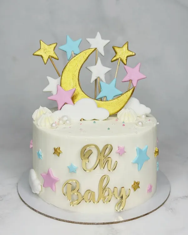 Baby shower? I've got you covered! This sweet "Oh Baby" cake features a moon and stars theme in pastel pink, blue, and gold. It's a dreamy cake for a special celebration.
