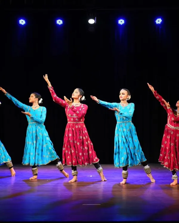 My students presenting their group choreography 'ARAMBH' on stage. Their synchronized movements and graceful postures reflect countless hours of dedicated practice.