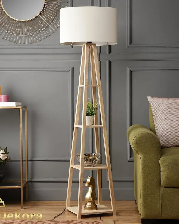 This wooden shelf lamp is one of our bestsellers, combining a clean, modern aesthetic with practical storage. Its natural wood finish and simple drum shade make it a versatile addition to any living room or bedroom corner.
