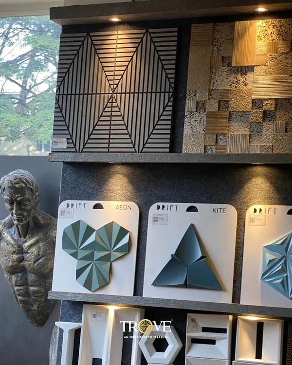 This display showcases a variety of my luxury 3D tiles. From geometric patterns that play with light and shadow to uniquely shaped tiles in striking colors, these designs are perfect for creating a modern and sophisticated feature wall that becomes a work of art itself.