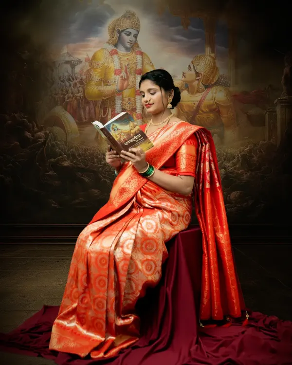 A serene portrait of a mother-to-be reading the Bhagavad Gita. The backdrop, inspired by classic Indian art, and the rich red saree come together to create a powerful image of spiritual motherhood.