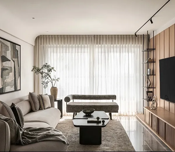 A look at a complete living space where every zone has its own personality yet flows together. This project combines a formal living area, a cozy guest corner, and a media unit, all unified by a warm, stylish aesthetic.