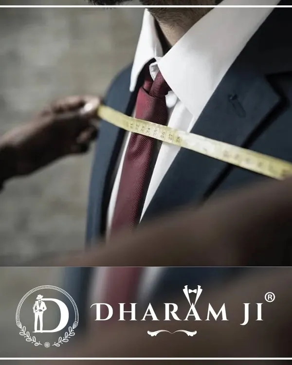 The journey to a perfect suit starts with the right measurement. Here, I am ensuring every detail is captured for a flawless fit.