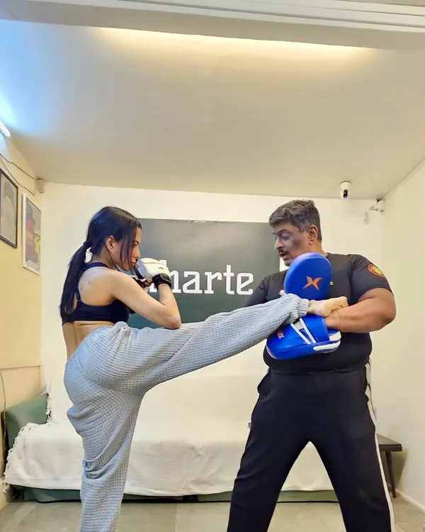 I teach you to be powerful, no matter your size. Here we are practicing a high kick, building strength and confidence with every session. This is about finding the fighter in you.
