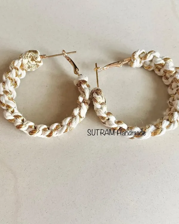 My macrame earrings with a golden touch! I weave a shiny zari thread with the off-white cotton to create these beautiful, sparkling hoops.