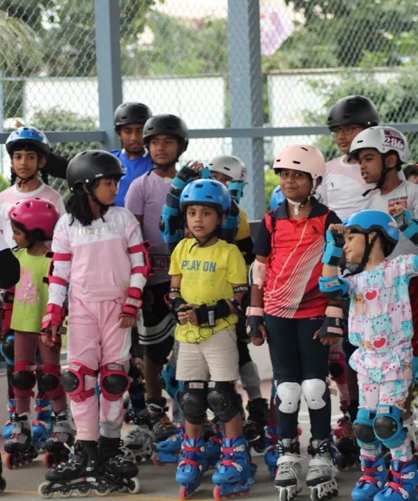 Here I am giving instructions to a group of eager learners before they start their practice. Clear communication and group drills are a key part of our beginner roller skating coaching.