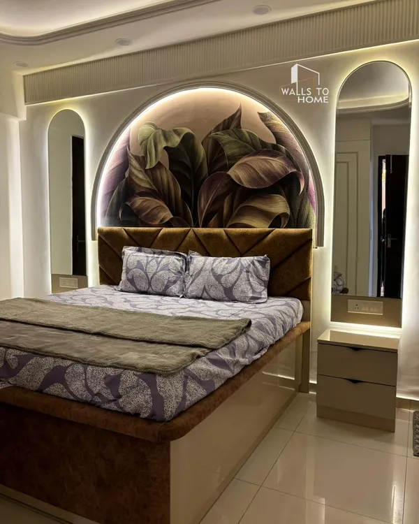 A master bedroom we designed to be a true sanctuary. The arched feature wall with botanical wallpaper, integrated backlit mirrors, and a custom upholstered bed come together to create a cozy, elegant space.