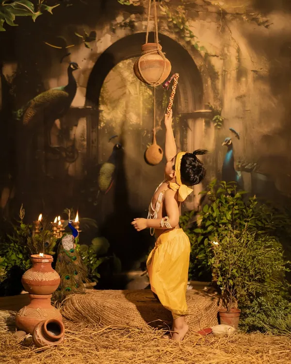 This is the magic I love to create. A playful moment of little Krishna trying to reach the matki, set in a dreamy Vrindavan I built right here in my studio. These divine shoots are about capturing innocence and tradition in one timeless frame.