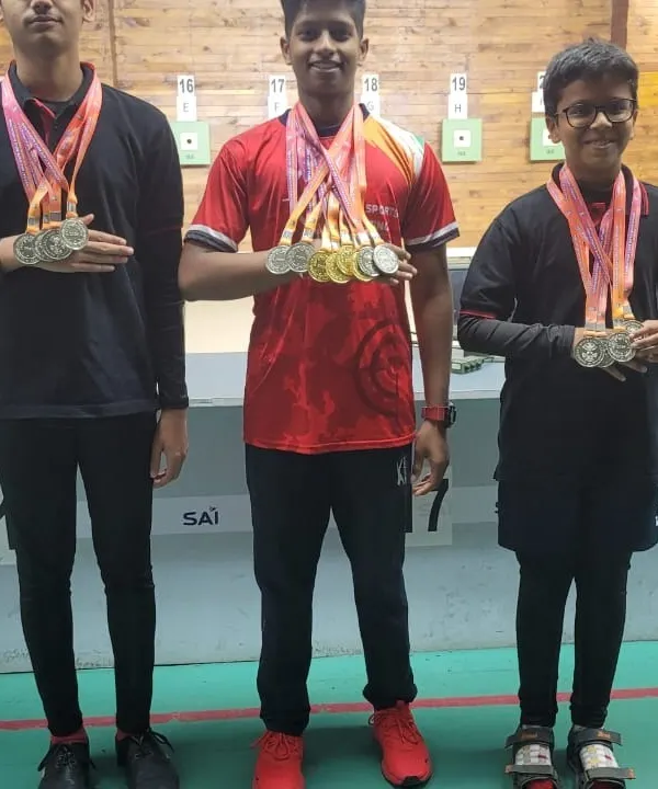 Our young champions proudly displaying their medals after a successful competition. We focus on developing talent from a young age, building a strong foundation for a long and successful shooting career.