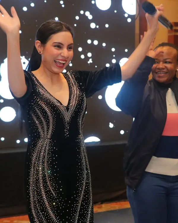 This is the joy I live for. Seeing guests light up and share a laugh is the best part of my job as a wedding emcee. Here I am, creating a fun, interactive moment during an evening celebration.