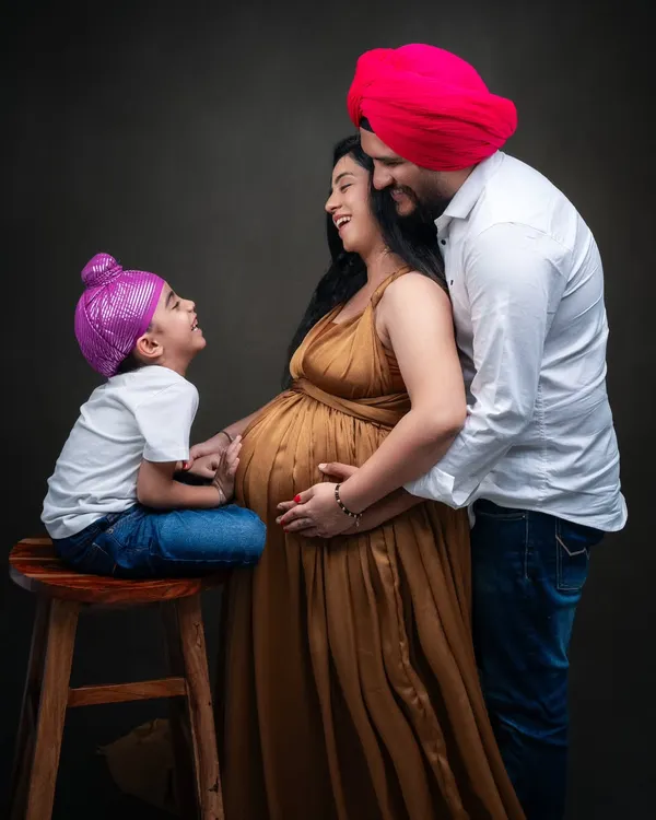 There is a special kind of joy in a family that is waiting to welcome a new life. In this studio maternity session, I focused on the natural interactions and laughter between the parents and their son. The warmth in their expressions tells a beautiful story of love and anticipation.